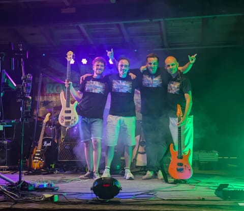 Rock’n’Beatz live on stage, all four wearing Union Jack shirts